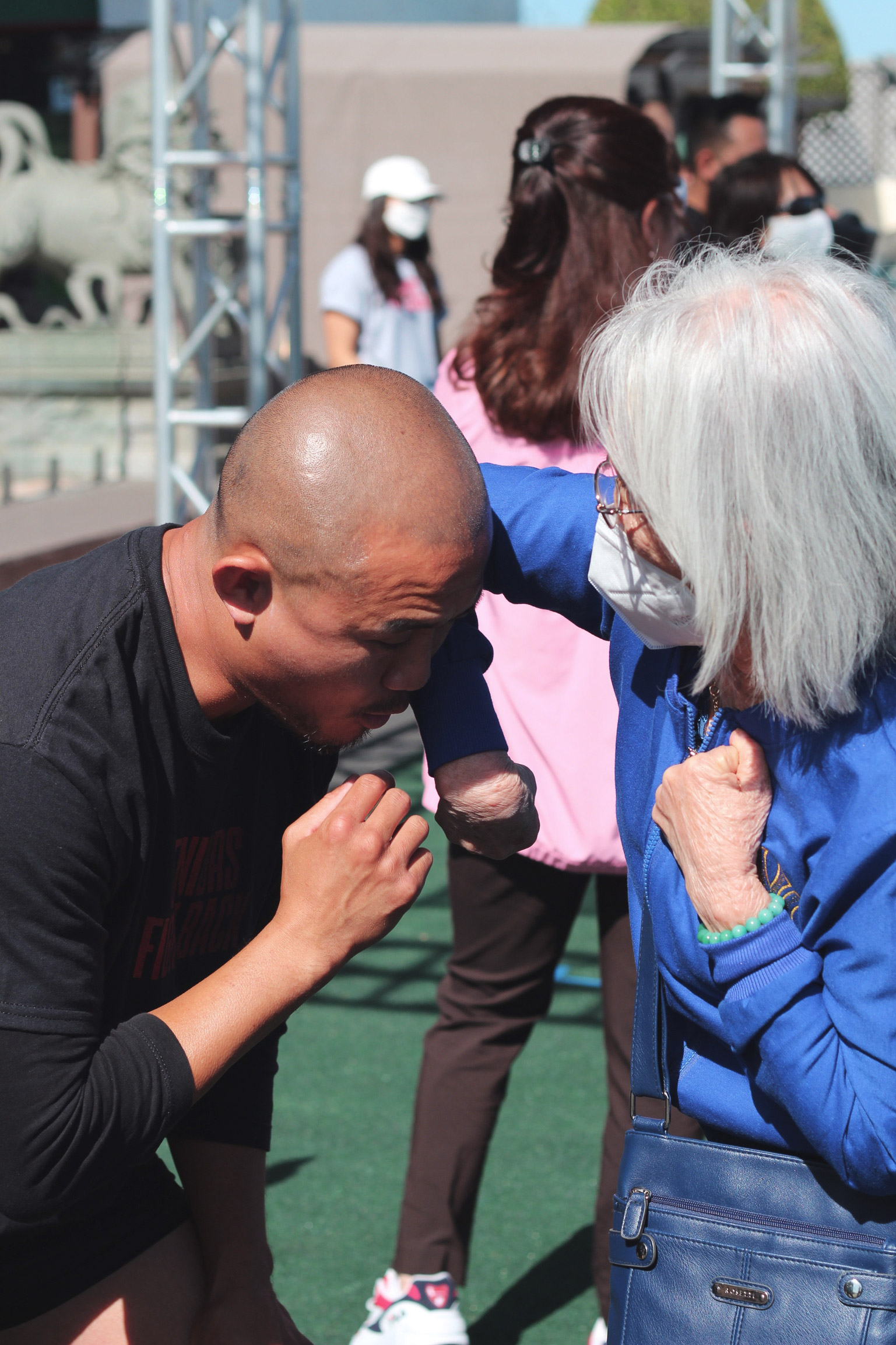 elderly woman learning how to elbow strike